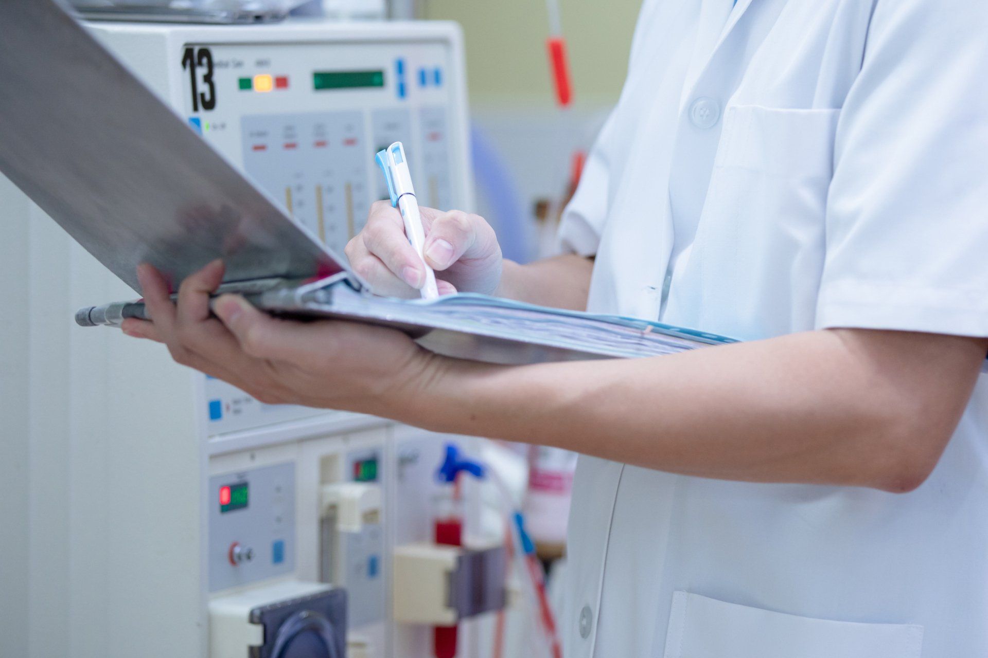 Specialist checking continuous renal replacement - Grand Rapids, MI - Urology Associates of Grand Rapids, PC