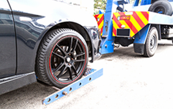 Tow truck pulling car - Emergency service towing in Oxnard, California Tow truck pulling car - Emergency service towing in Oxnard, California