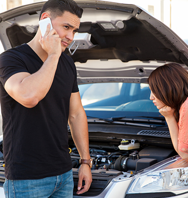 Man calling for towing service - Emergency service towing in Oxnard, California Man calling for towing service - Emergency service towing in Oxnard, California