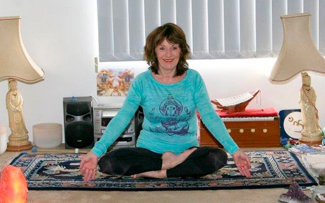 Principal Judi McVea taking a yoga class