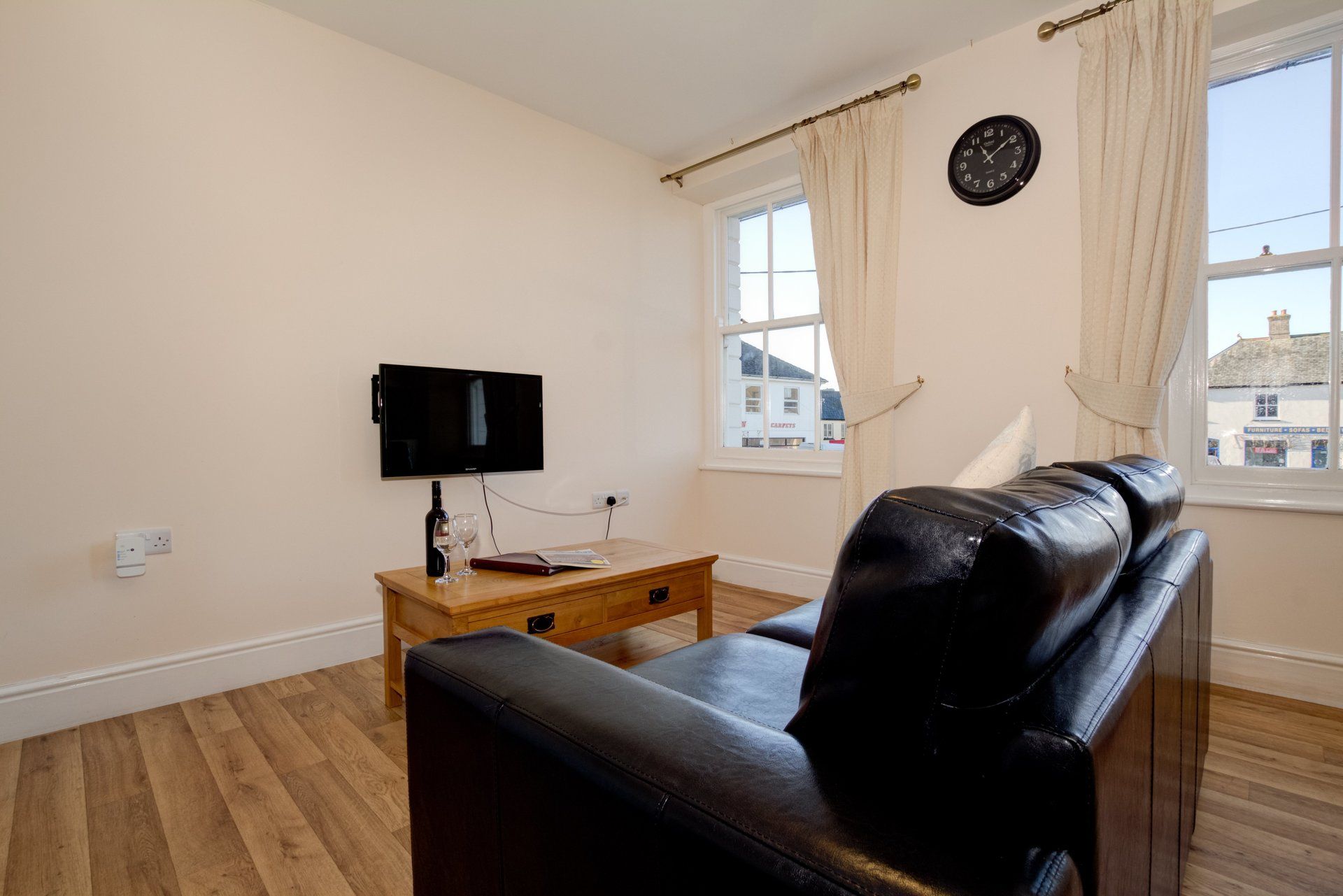 comfortable leather sofa and flat-screen TV