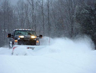 Snow Management — Car On a Snow Road in Troy, MI