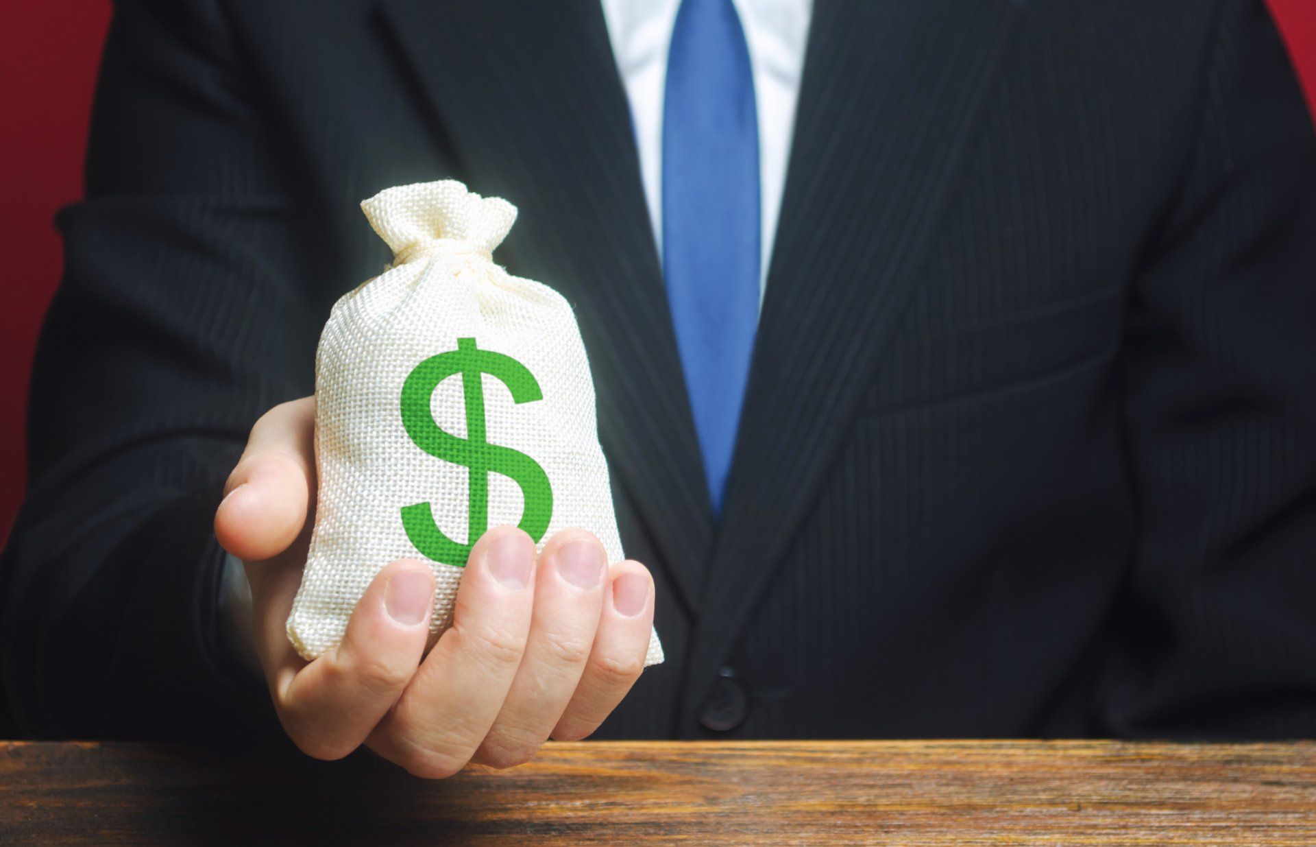 Bag of Money in Hand
