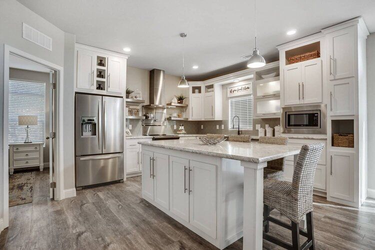 Kitchen with Stainless Steel Appliance and Island with Seating