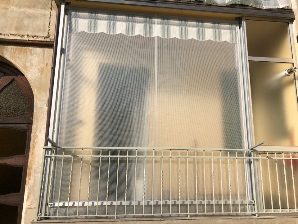 Tende per veranda in tessuto.