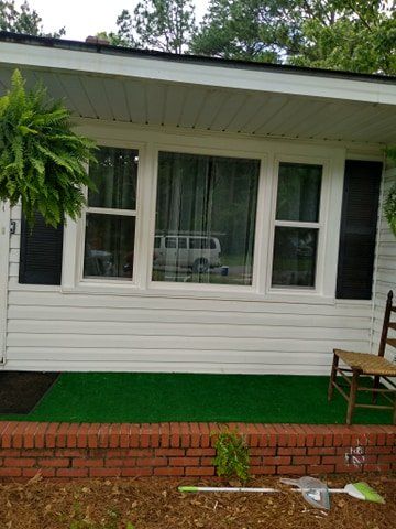 Vinyl front window replacement for a home