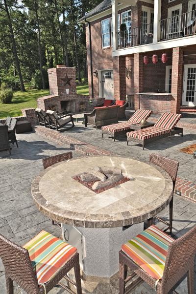 large patio with fire pit fireplace and outdoor seating