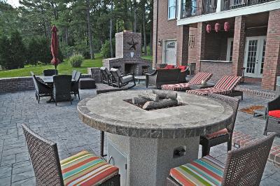 large patio with fire pit fireplace and outdoor seating
