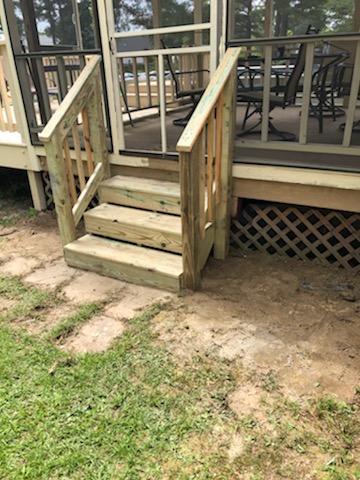 wooden stairs leading into screened porch