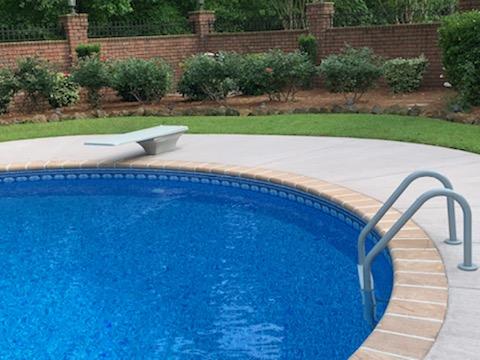 inground pool with diving board