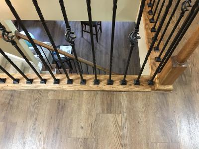 decorative wrought iron baluster looking down stairs
