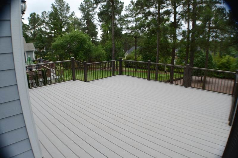 new gray deck with dark gray metal railing