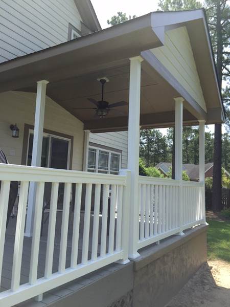 covered porch with ceiling fan