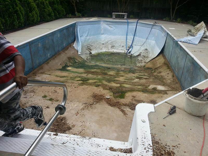 liner being removed from inground pool
