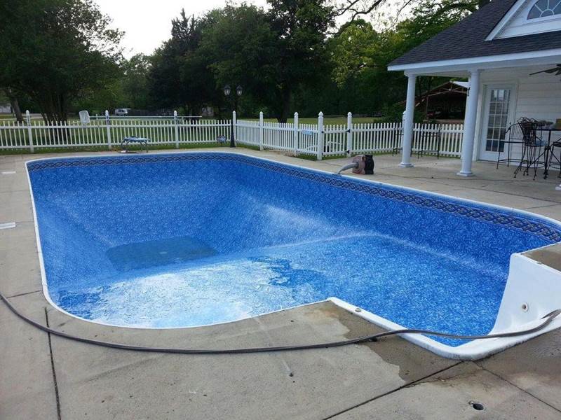 inground pool being filled after repairs