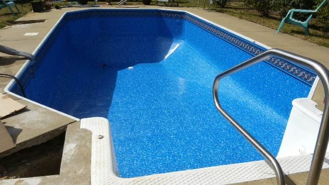 inground pool being filled after repairs