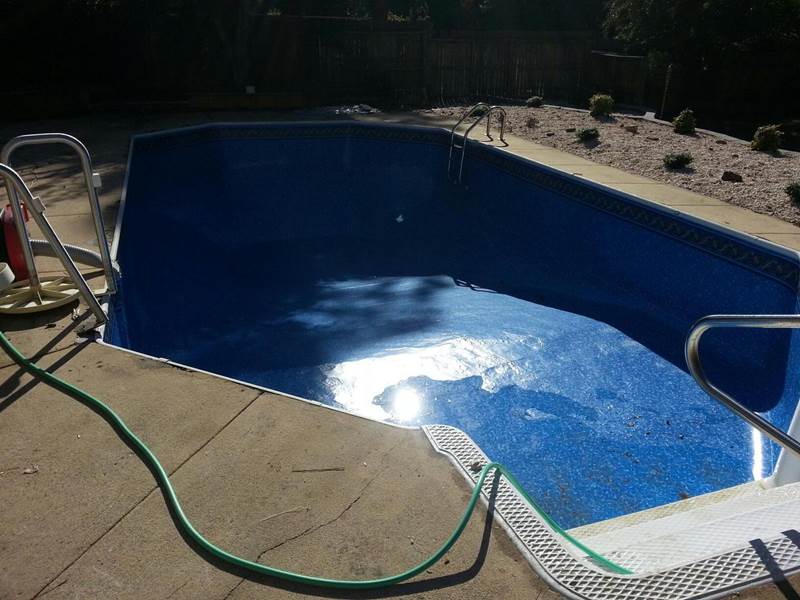 inground pool being filled after repairs