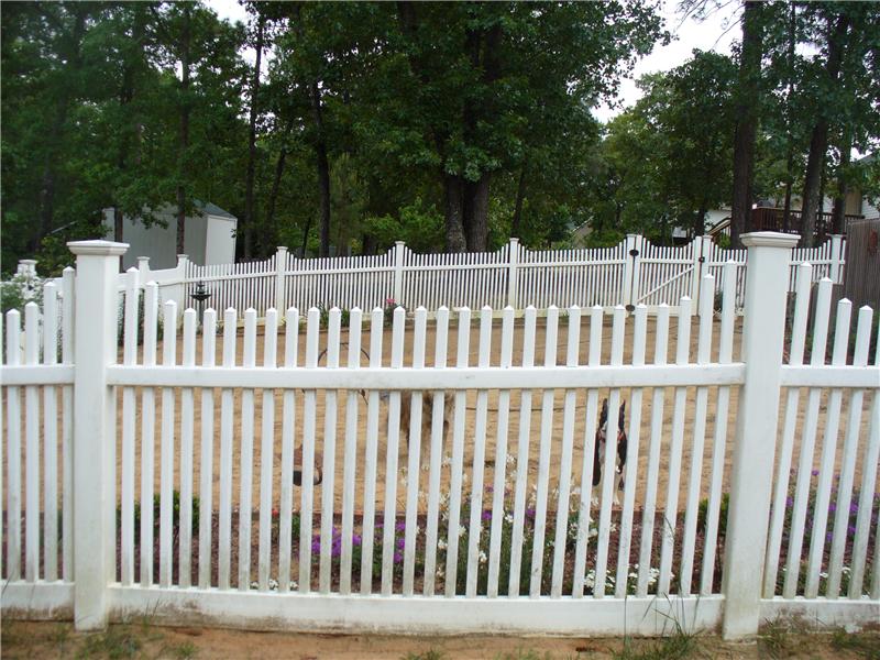 exterior view of white vinal picket fence