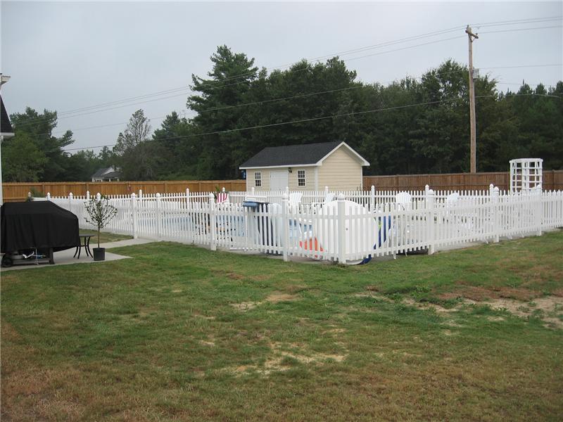 white vinyl picket fence surround pool