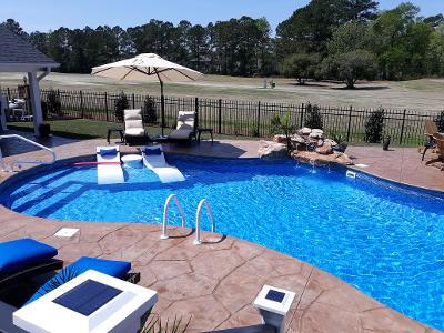 lounge chairs in pool