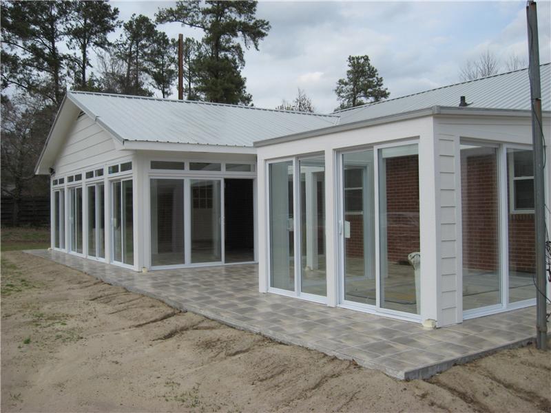 sunroom addition on back of brick house