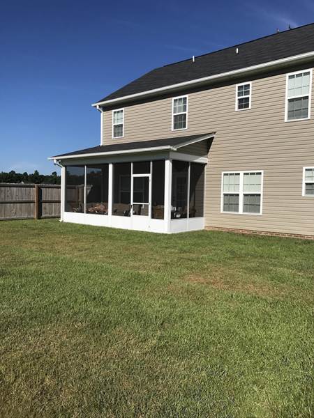 screened porch on back of house