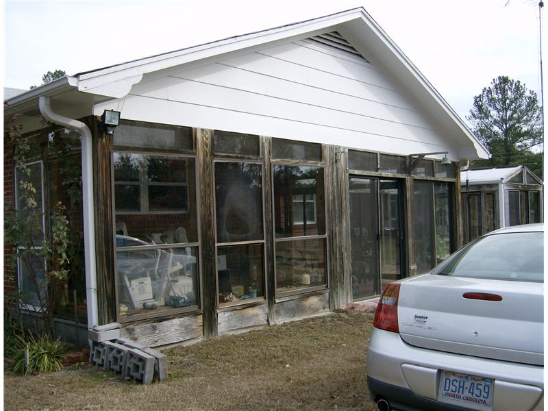 rustic wooden sunroom addition