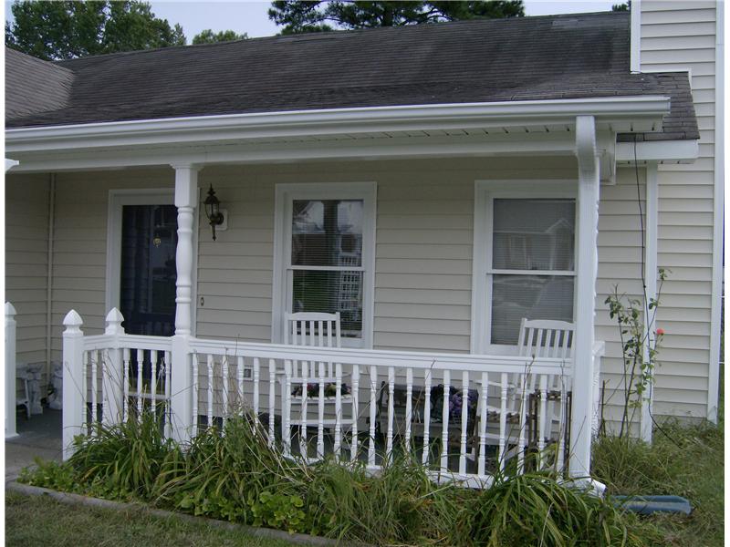 completed front porch with new siding on house