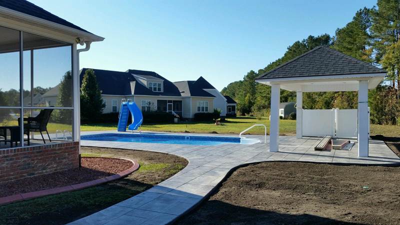 decking leading to pool with slide