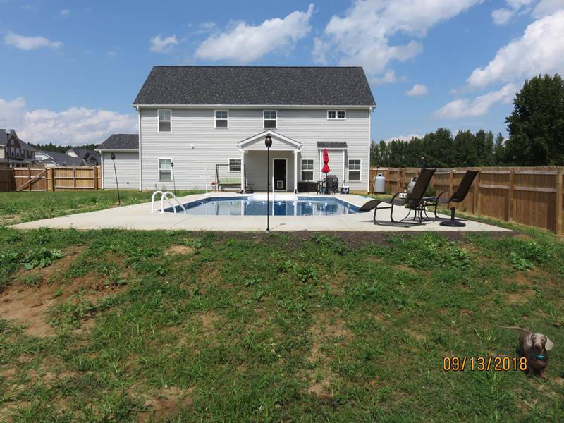 back yard with pool and back of house