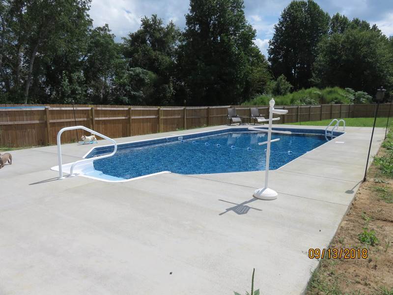 inground pool with cement decking