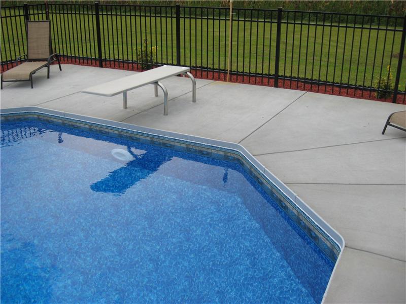 inground pool with diving board
