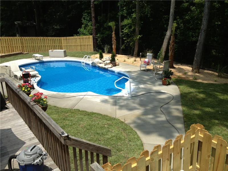view of inground pool from deck