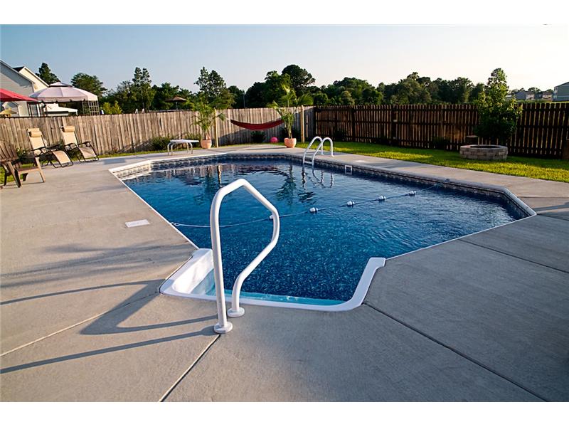 stairs with handrail leading into pool
