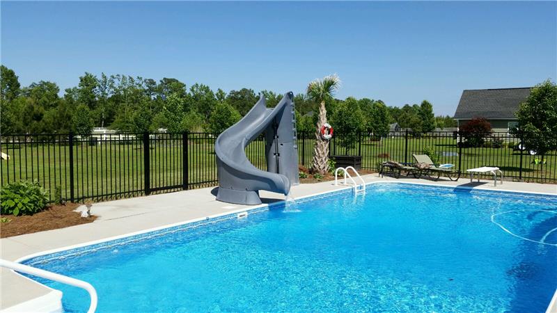 rectangular pool with sliding board