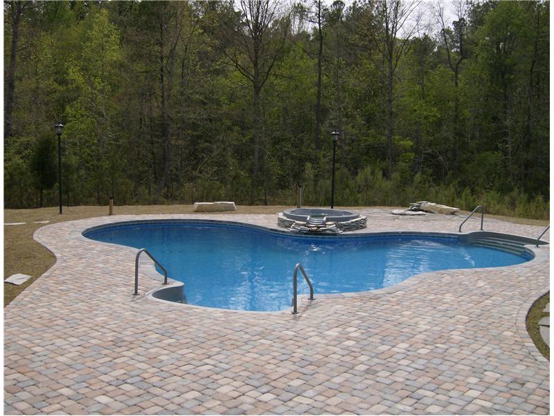 freeform pool with jacuzzi
