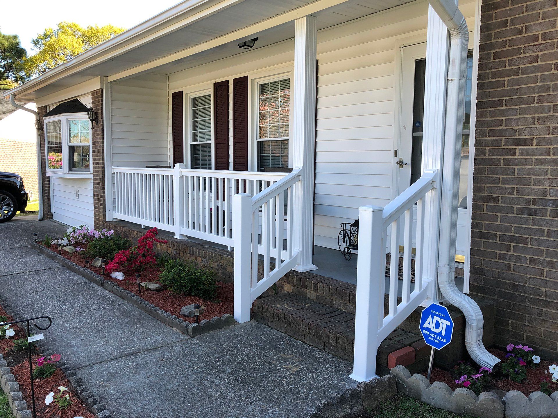 front porch on white and brick house