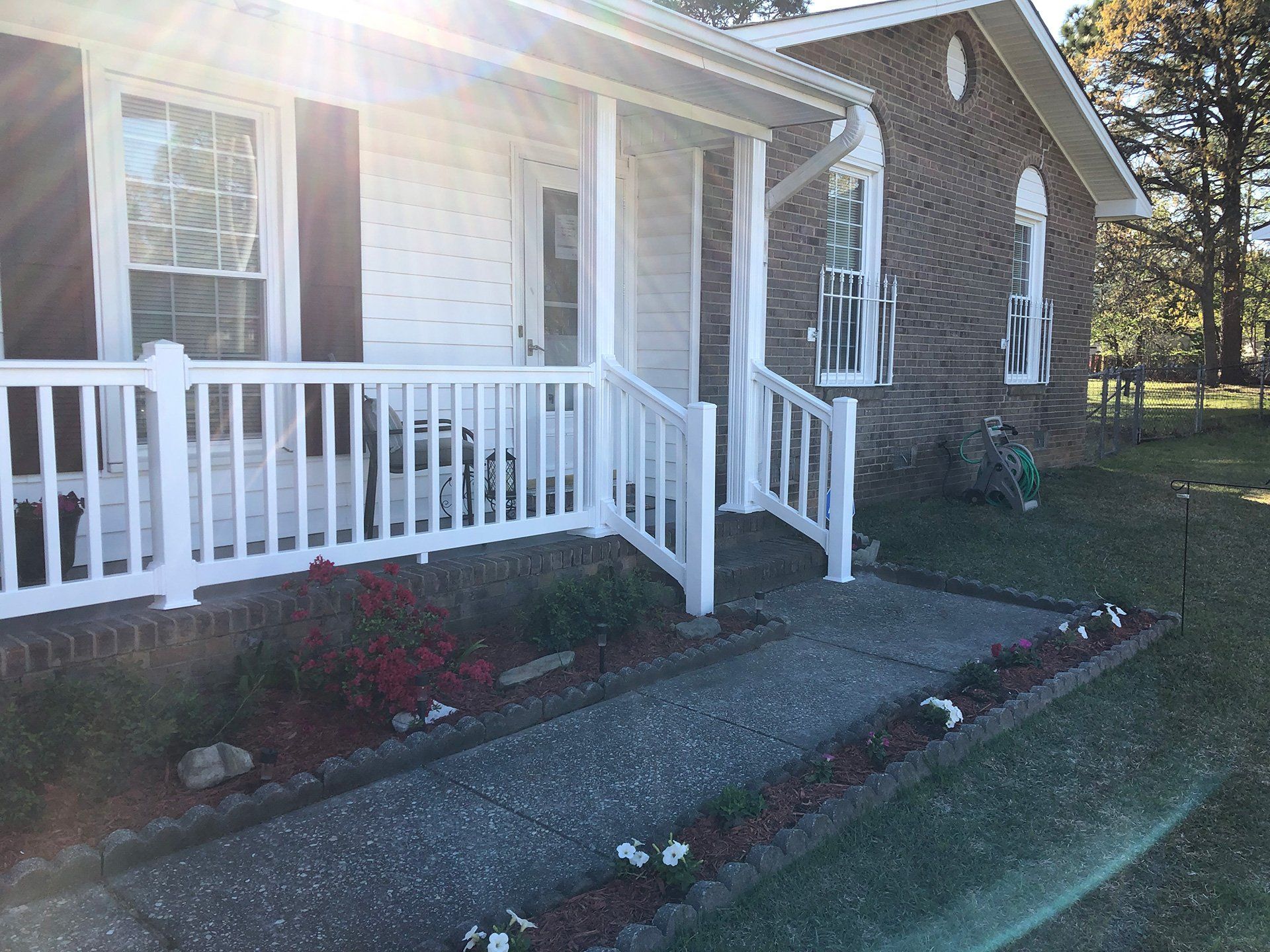 front porch on white and brick house