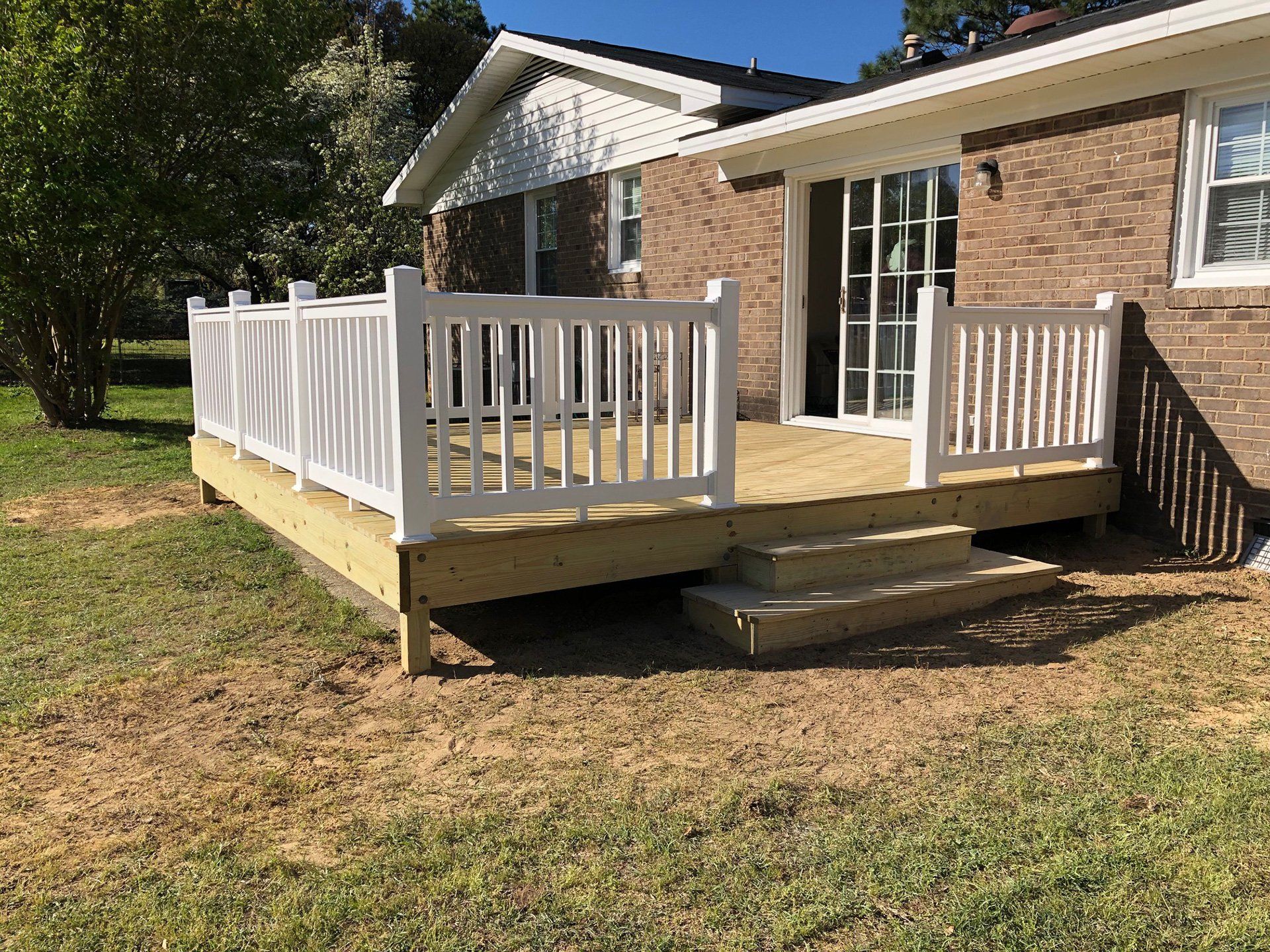 Deck with vinyl white railing