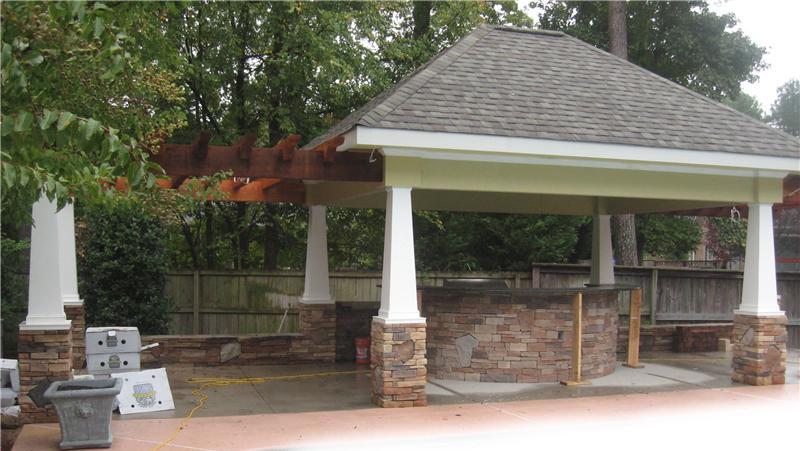 covered area with outdoor kitchen under construction