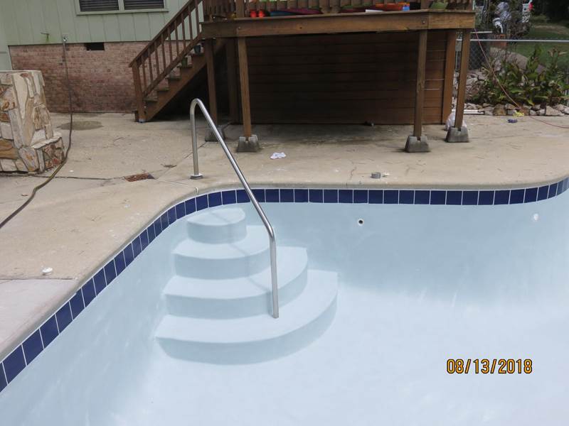 emplty inground pool after replaster