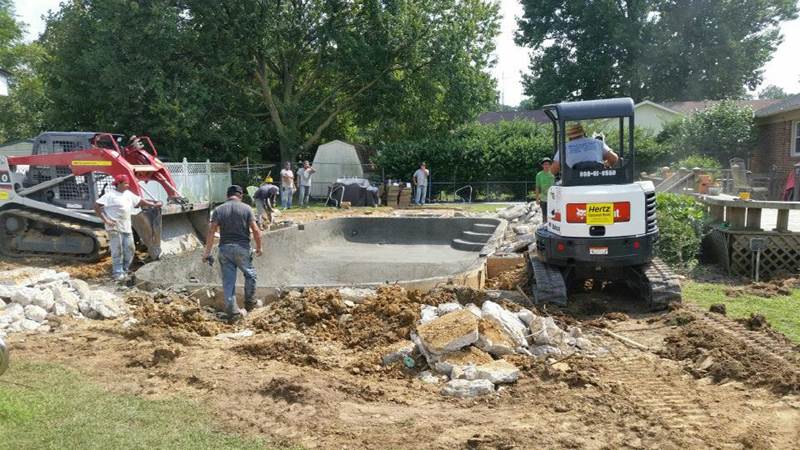 back hoes working on construction of inground pool