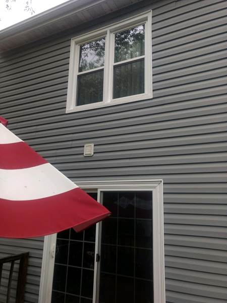 double window on second level over sliding door