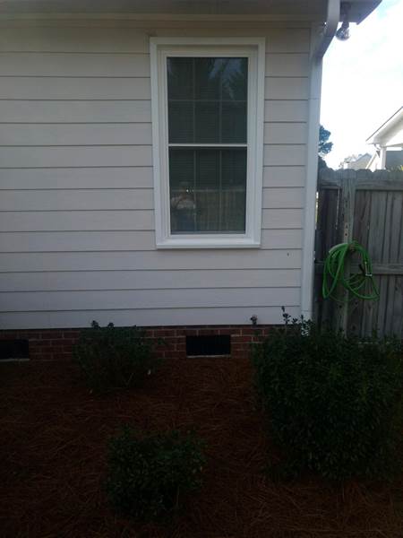 small single window on side of house