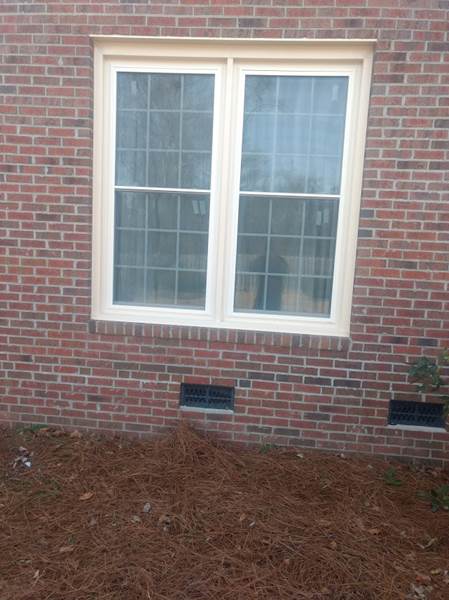 double window on side of brick house