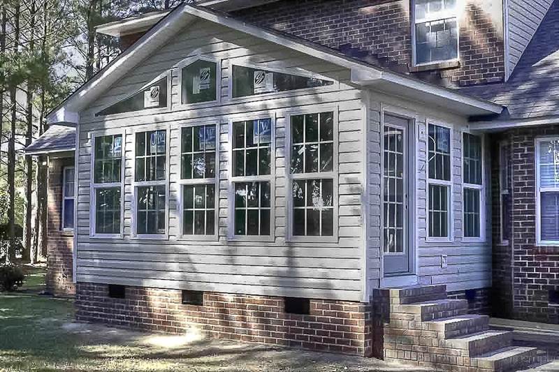 sunroom added to back of brick house
