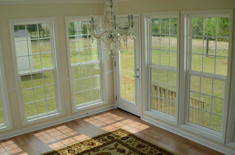 inside view of sunroom with crystal chandelier