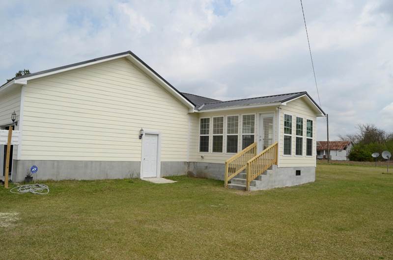 sunroom addition with stairs leading up