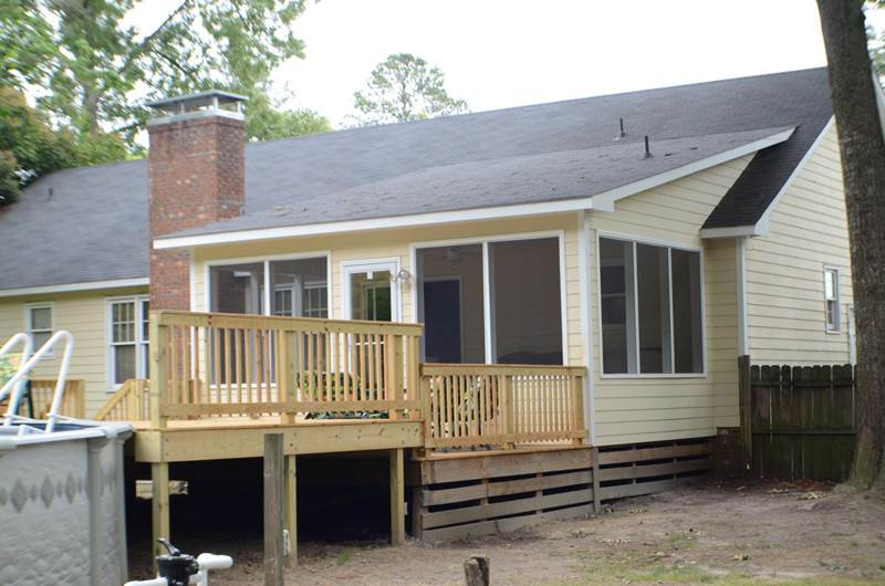 side view of deck railing off sunroom