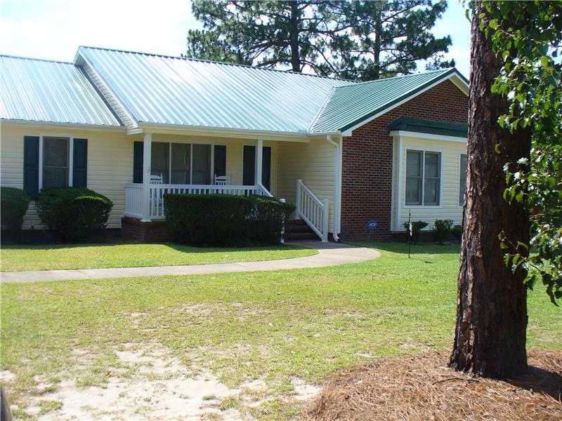 Yellow & Brick Home with New Vinyl Siding, Fayetteville NC Siding Contractor